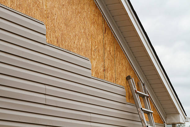 Professional Emergency Siding Repair technician working in Berea, OH